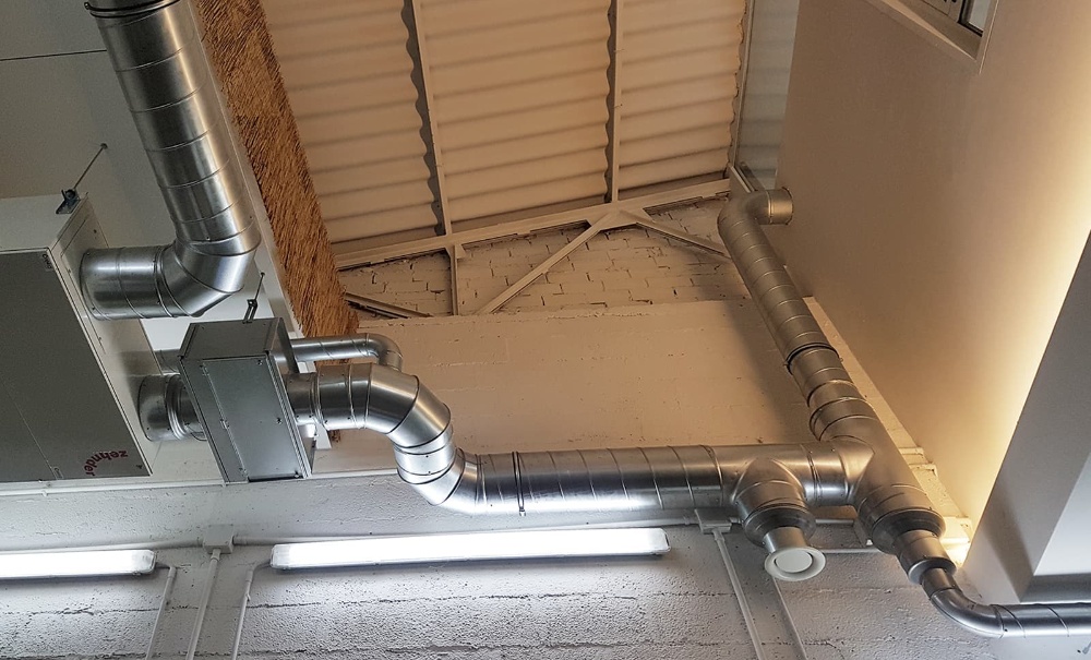 REHABILITA CON ÉXITO - Instalación de recuperador de calor en pabellón industrial