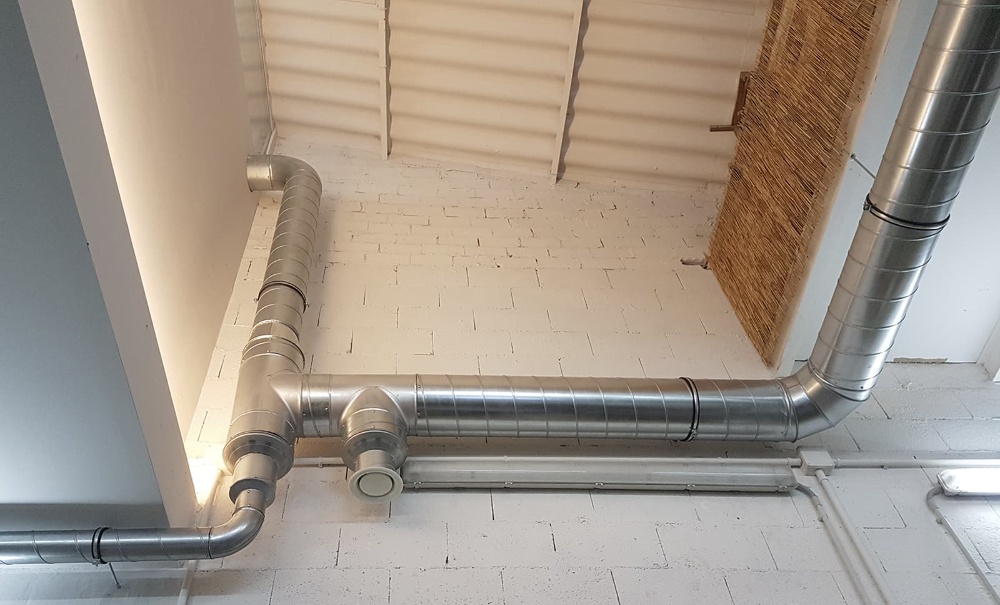 REHABILITA CON ÉXITO - Instalación de recuperador de calor en pabellón industrial